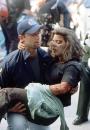 An emergency worker helps a women after she was injured in the terrorist attack on the World Trade Center in New York, Tuesday, Sept. 11, 2001. (AP Photo/Gulnara Samiolava)