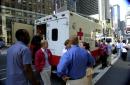 Red Cross volunteers tell people who want to donate blood where to go following a terrorist attack on the World Trade Center in New York, Tuesday, Sept. 11, 2001. Red Cross officials put out a call for blood to treat those injured in the attack. (AP Photo/Tim Donnelly)