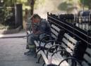 A firefighter pauses on a bench as he works in lower Manhattan at the scene of the World Trade Center terrorist attack, Tuesday, Sept. 11, 2001. In a horrific sequence of destruction, terrorists crashed two planes into the World Trade Center and the twin 110-story towers collapsed. (AP Photo/Matt Moyer)