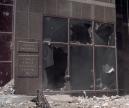 Broken windows and debris fill the entrance to the Lehman Brothers headquarters in New York, Tuesday, Sept. 11, 2001. Terrorists crashed two planes into the upper floors of both World Trade Center towers minutes apart Tuesday morning in a horrific scene of explosions and fires that collapsed the 110-story buildings, spreading wreackage over the area.  (AP Photo/Boudicon One)