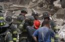 Firefighters sift through the wreckage after terrorists crashed two jets into the World Trade Center in  New York, Tuesday, Sept. 11, 2001. The jetliners crashed into the upper floors of both World Trade Center towers collapsing the  110-story buildings. (AP Photo/Boudicon One)