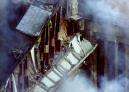 In this close-up view, damage to the Pentagon is seen Tuesday, Sept. 11, 2001 after the building took a direct, devasting hit from an aircraft. (AP Photo/Hillery Smith Garrison)