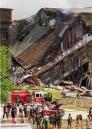 Rescue worker look over damage at the Pentagon Tuesday, Sept. 11, 2001. The Pentagon burst into flames and a portion of one side of the five-sided structure collapsed after the building was hit by an aircraft in an apparent terrorist attack. (AP Photo/Kamneko Pajic)