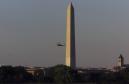 Marine One, carrying President Bush, flies past the Washington Monument Tuesday, Sept. 11, 2001, as he returns to the White House. As chaos unhinged in New York and Washington, the president was flown from Florida to Louisiana to Nebraska, and then, accompanied by three decoy helicopters, safely back to the White House. (AP Photo/Hillery Smith Garrison)