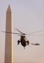 Marine One Helicopter, carring President Bush aboard, passes by the Washington Monument, as they prepare land on the South Lawn of the White House Tuesday, Sept. 11, 2001 in Washington. Bush returned to Washington to address the nation. (AP Photo/Pablo Martinez Monsivais)