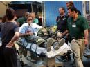 Emergency workers attend to an injured man outside the Beth Israel Medical Center in New York, Tuesday, Sept. 11, 2001 following a terrorist attack on the World Trade Center. (AP Photo/Louis Lanzano)