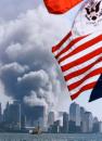 Flags fly at half-mast in Weehawken, N.J., as columns of smoke rise from the site of the decimated World Trade Center in lower Manhattan, New York, Tuesday, Sept. 11, 2001. (AP Photo/Jeff Zelevansky)