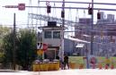 A guard mans a gate at the Y-12 nuclear weapons plant in Oak Ridge, Tenn., on Tuesday, Sept. 11, 2001. The Department of Energy reduced staffing at the its Y-12 nuclear weapons plant, its national laboratory and other buildings at Oak Ridge. Only essential personnel were allowed in buildings. Hundreds of contract workers were ordered to go home or not to report for evening shifts. (AP Photo/Wade Payne)