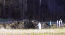 Emergency workers look at the crater created when United Airlines Flight 93 crashed near Shanksville, Pa., on Tuesday, Sept. 11, 2001. Radar showed the San Francisco-bound Boeing 757 from Newark, N.J., had nearly reached Cleveland when it made a sharp left turn and headed back toward Pennsylvania, crashing in a grassy field edged by woods about 80 miles southeast of Pittsburgh. FBI spokesman Jeff Killeen confirmed there were no survivors. (AP Photo/Keith Srakocic)