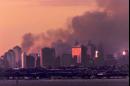 Lower Manhattan is shown as night falls Tuesday, Sept. 11, 2001, from Atlantic Highlands, N.J.  Terrorists crashed two hijacked airliners into the World Trade Center and brought down the twin 110-story towers. The World Trade Center had stood on the left side of the skyline .(AP Photo/Rusty Kennedy)