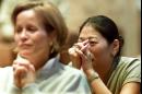 Two unidentified women pray during a mass Tuesday, Sept. 11, 2001, at Holy Name Cathedral in Chicago for the victims and survivors of Tuesday's terrorist attacks in New York and Washington. (AP Photo/Ted S. Warren)