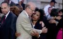 Sen. Pat Roberts, R-Kan., center, hugs Rep. Juanita Millender-McDonald, D-Calif., right, as Sen. Charles Schumer, D-NY, left, walks by. Members of Congress from across the political spectrum showed unity on Capitol Hill, Tuesday, Sept. 11, 2001, in Washington, after a day which saw two planes crash into the World Trade Center in New York, and one into the Pentagon, all considered acts of terrorism. (AP Photo/Kenneth Lambert)