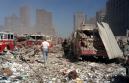 Debris covers firetrucks and emergency vehicles near the World Trade Center in New York, Tuesday, Sept. 11, 2001. A terrorist attack collapsed the 110-story buildings spreading wreckage over lower Manhattan. (AP Photo/Boudicon One)