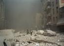 FIremen walk through a dust and debris covered street in lower Manhattan Tuesday, Sept. 11, 2001, after a terrorist attack at the World Trade Center. Two jet planes were crashed into the twin towers, collapsing them and covering the area with the debris.(AP Photo/Richard Cohen)