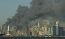 Thick smoke billows into the sky from the area behind the Statue of Liberty, lower left, where the World Trade Center towers stood Tuesday, Sept. 11, 2001.  The towers collapsed after terroists crashed two planes into them Tuesday. (AP Photo/Daniel Hulshizer)