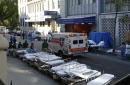 An ambulance arrives at the emergency entrance of Beth Israel Hospital on the lower eastside of Mahattan, New York, Tuesday, Sept. 11, 2001. Equipment and personnel wait in the steeet for a possible influx of casualitites following the collapse of the World Trade Center towers. (AP Photo/Amy Sancetta)