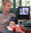 While watching television footage of the attack in New York City, Janice Mould, a Florida State University student from Athens, Ohio, donates blood at the Southeast Community Blood Center on Tuesday, Sept. 11, 2001, in Tallahassee, Fla. Mould said she just wanted to help the diaster victims in New York by donating blood.  Officials at the center stated they had never had the volume of people wanting to give blood as they had Tuesday. (AP Photo/Phil Coale)