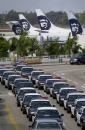 A fleet of police cars line up outside Los Angeles International Airport after the airport was shutdown due to the attacks on the East Coast, Tuesday, Sept. 11, 2001. In one of the most horrifying attacks ever against the United States, two airliners crashed into the World Trade Center in a deadly series of blows that brought down the twin 110-story towers. A plane also slammed into the Pentagon in Washington as the government itself came under attack. (AP Photo/Nick Ut)