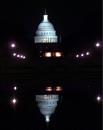 The Capitol building is reflected in a pool of water at the end of a dark day in the history of the United States Tuesday, Sept. 11, 2001, in Washington. All government agencies were closed in Washington after terrorist attacks in New York and Washington. (AP Photo/Joe Marquette)