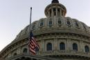 Flag flies at half staff over the Capitol Tuesday Sept.11, 2001, in Washington. Government agencies were closed and security on an all time high after the New York and Washington terrorist attacks. (AP Photo/Joe Marquette)