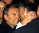 Sen. Majority Leader Tom Daschle, D-S.D., left, hugs Republican House member George Gekas, R-Pa., after a prayer service on the steps of the U.S. Capitol Tuesday, Sept. 11, 2001, in Washington.  All government agencies were closed in Washington.  (AP Photo/Joe Marquette)