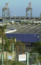 A tractor-trailer blocks truck entrance as cranes stand idle in the background at the APL Terminal as this and every other facility in the Port of Los Angeles and neighboring Long Beach were shut down Tuesday, Sept. 11, 2001. The closure came after terrorists attacksin New York and Washington ea Tuesday morning. (AP Photo/Reed Saxon)