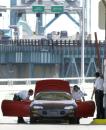 U.S. Customs agents inspect a vehicle entering the United States via the Ambassador Bridge from Windsor, Ontario into Detroit, Tuesday, Sept. 11, 2001. Security was heightened in the wake of terrorist attacks on the United States.  (AP Photo/Paul Sancya)