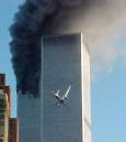 A jet airliner is lined up on one of the World Trade Center towers in New York Tuesday, Sept. 11, 2001. In the most devastating terrorist onslaughts ever waged against the United States, knife-wielding hijackers crashed two airliners into the World Trade Center on Tuesday, toppling its twin 110-story towers. (AP Photo/Carmen Taylor)