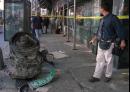 A peice of debris, possibly from one of the crashed airliners, is roped off by investigators near the World Trade Center site in New York, Tuesday, Sept. 11, 2001. Two planes crashed into the upper floors of the World Trade Center towers minutes apart Tuesday morning, collapsing the 110-story buildings. (AP Photo/Lucian Mihaesteanu)