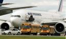 Buses line up to transport passengers near an Air France 767 at the Edmonton International Airport Tuesday, Sept. 11, 2001. Repercussions from a devastating series of terrorist attacks in the New York and Washington rippled across Canada on Tuesday as thousands of travellers were stranded at airports, offices were shut down and Canadian hospitals prepared to take in America's wounded. (CP PHOTO/Edmonton Sun-Darryl Dyck)