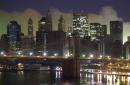 Smoke hangs in the air over lower Manhattan with the Brooklyn Bridge in the foreground as seen from the Manhattan Bridge in New York, early Wednesday morning, Sept. 12, 2001. The 110-story twin towers of the World Trade Center dominated this scene before they collapsed Tuesday after being hit by hijacked airliners. (AP Photo/Robert F. Bukaty)