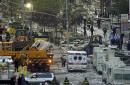 Firefighters, rescue workers and other personnel work on clearing the area of the remains of the World Trade Center Twin Towers'  in downtown New York Wednesday, Sept. 12, 2001. (AP Photo Lawrence Jackson)