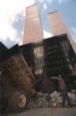 FILE--Construction worker Anthony DiMaggio directs a dump truck outside the World Trade Center in New York in this March 11, 1993 file photo, as it discharges debris from an explosion that the FBI confirmed was caused by a bomb.  In one of the most horrifying attacks ever against the United States, terrorists crashed two airliners into the World Trade Center Tuesday, Sept. 11, 2001, that brought down the twin 110-story towers.  (AP Photo/Richard Drew, File)