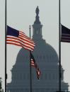 With the Capitol in the background, flags fly at half-staff on the Washington Monument grounds Wednesday, Sept. 12, 2001 to honor the lives lost in the terrorist attacks at the Pentagon and in New York. (AP Photo/Joe Marquette)