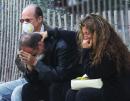 People comfort each other near the site of the World Trade Center in New York Wednesday, Sept. 12, 2001 as they react to Tuesday's destruction of the twin towers. (AP Photo/Paul Chiasson)