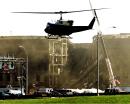 A miltary helicopter lands at the Pentagon in Washington, Wednesday, Sept. 12, 2001, as a construction crane in the background helps with recovery efforts. The Pentagon said Wednesday no more survivors are expected to be pulled from the rubble following the terrorist attack that sent a jetliner into the side of the building. (AP Photo/Ron Edmonds)