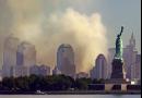 With the Statue of Liberty standing in New York Harbor, smoke rises from lower Manhattan following the destruction of buildings at the World Trade Center in New York, Wednesday Sept. 12, 2001.  Two hijacked commercial aircraft crashed into the center's towers. (AP Photo/Charles Krupa)