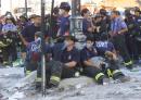 Firefighters rest as rescue efforts continue at the World Trade Center in New York Wednesday Sept. 12, 2001.  Many firemen are missing and feared dead in the rubble from the terrorist attack Tuesday. (AP Photo/ Beth Keiser)