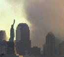 RETRANMISSION TO PROVIDE ALTERNATE IMAGE--The Statue of Liberty stands in the early morning light in New York harbor as smoke continues to rise from what is left of the World Trade Center towers in this view from Jersey City, N.J., Wednesday, Sept. 12, 2001. (AP Photo/Mike Derer)