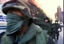 Members of the Army National Guard march pass Stuyvesant High School in New York, on their way to take security positions blocks from the site of the World Trade Center attack, Wednesday morning, Sept. 12, 2001. (AP Photo/ Victoria Arocho)