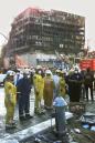 Emergency Service personel take a break near the site of the World Trade Center, Wednesday, Sept. 12, 2001 in New York. (AP Photo/Paul Chiasson)