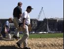 FBI investigators comb an area in front of the Pentagon in Washington, Wednesday, Sept. 12, 2001, looking for evidence from the hijacked airliner's crash into the Pentagon building Tuesday.  (AP Photo/Steve Helber)