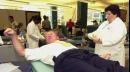 Philadelphia Police Commissioner John Timoney, left, gestures as nurse Cheryl Ellsworth draws blood at the Red Cross blood bank in Philadelphia Wednesday, Sept. 12, 2001. Blood banks were overwealmed with calls from people volunteering to donate blood for those affected by Tuesday's terrorist attacks in New York and Washington.     (AP Photo/Sabina Pierce)