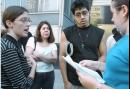 Nelcy Campana, second from left, and her son, Gustavo, seek information Wednesday Sept. 12, 2001, at NYU Medical Center about her father, who is missing after the World Trade Center collapse.  Volunteer Shaindi Mayersdars, left, and an unidentified volunteer check hospital admission lists. (AP Photo/Diane Bondareff)