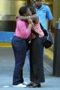 Two women hug as they wait Wednesday, Sept. 12, 2001, to get information on people admitted to NYU Medical Center.  People seeking information on relatives missing after Tuesday's terrorist attack at the World Trade Center gathered at the hospital. (AP Photo/Diane Bondareff)