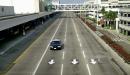 A police car cruises past deserted terminal buildings and parking structures at Los Angeles International Airport early Wednesday morning, Sept. 12, 2001. The airport remained idle after Tuesday's terrorist attacks on the World Trade Center in New York and the Pentagon in Washington forced its closure. The Federal Aviation Administration extended its nationwide ban on flying Wednesday and said it was not sure when airline flights would resume. (AP Photos/Nick Ut)