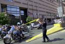 Boston police officers cordon off the entrance to the Westin Hotel in Boston, Wednesday, Sept. 12, 2001, after a team of FBI agents searching for suspects in the terrorist attacks in New York and Washington stormed the hotel.  As a large crowd gathered outside, one person was seen taken out of the hotel and put in a van, but a law enforcement official said said no one connected to the terror attacks had been arrested.  (AP Photo/Elise Amendola)