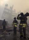 Firemen are deployed near the site of the World Trade Center in New York, Wednesday, Sept. 12, 2001.  In the most devastating terrorist onslaught ever waged against the United States, knife-wielding hijackers crashed two airliners into the World Trade Center on Tuesday, toppling its twin 110-story towers. (AP Photo/Mark Lennihan)