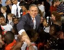 School children from Justina Elementary School in Jacksonville, Florida, surround President George W. Bush following a 'Leadership Forum' on reading, September 10, 2001. Bush called for a 'war on illiteracy' as he made a pitch for his education proposals even as worries about the weak economy began to push them down the political agenda.  (Win McNamee/Reuters)