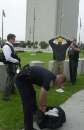 A member of the emergency response team of the FBI stands guard as officers detain an unidentified man and search his bag outside the Federal Building in Los Angeles, September 11, 2001. The Los Angeles office of the FBI is located in the building and  was closed due to terrorism acts in New York and Washington.  REUTERS/Jim Ruymen